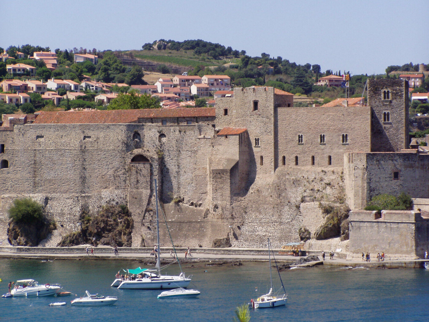 Boats below the Royal Castle and hillside homes in Collioure on France's Mediterranean coast